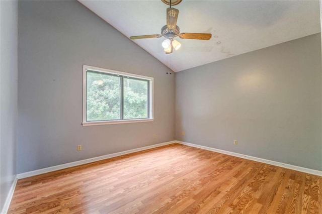 227 Margo Trl, Rome, GA 30161 - spare room with light wood-type flooring, ceiling fan, baseboards, and vaulted ceiling