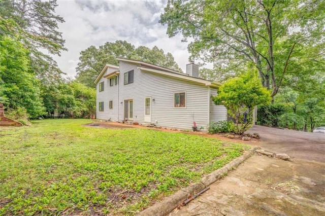 227 Margo Trl, Rome, GA 30161 - view of property exterior featuring a chimney and a yard