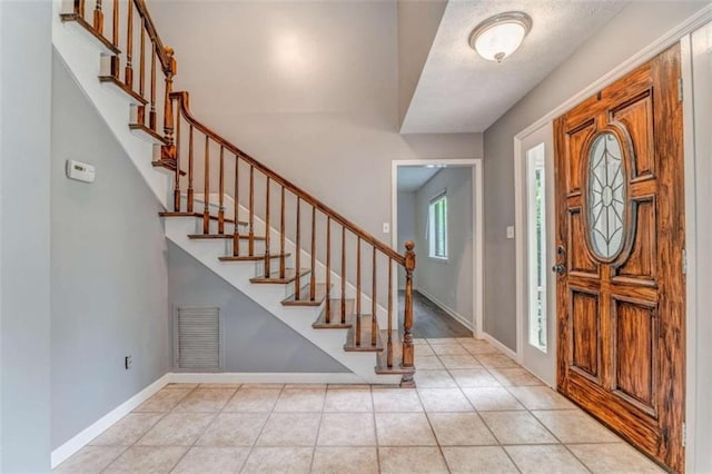 227 Margo Trl, Rome, GA 30161 - foyer featuring stairs, baseboards, and light tile patterned floors