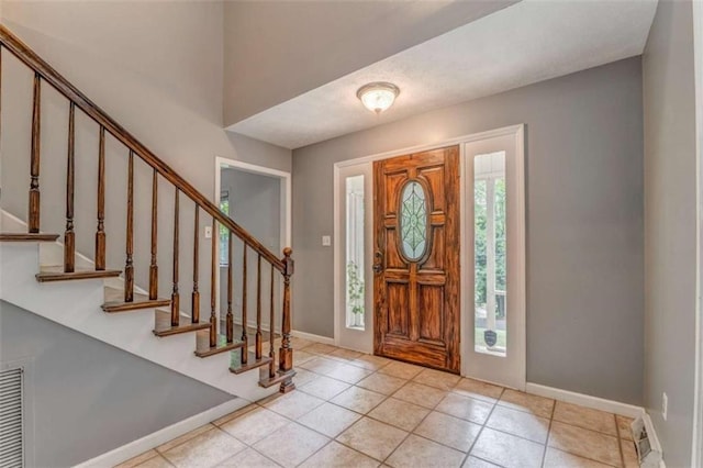 227 Margo Trl, Rome, GA 30161 - entryway with stairs, baseboards, and tile patterned flooring