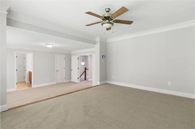 unfurnished room with light colored carpet, ornamental molding, and ceiling fan