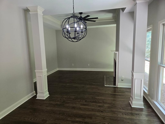 unfurnished dining area with crown molding, decorative columns, dark hardwood / wood-style floors, and ceiling fan