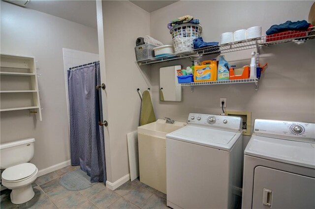 laundry room with washer and clothes dryer