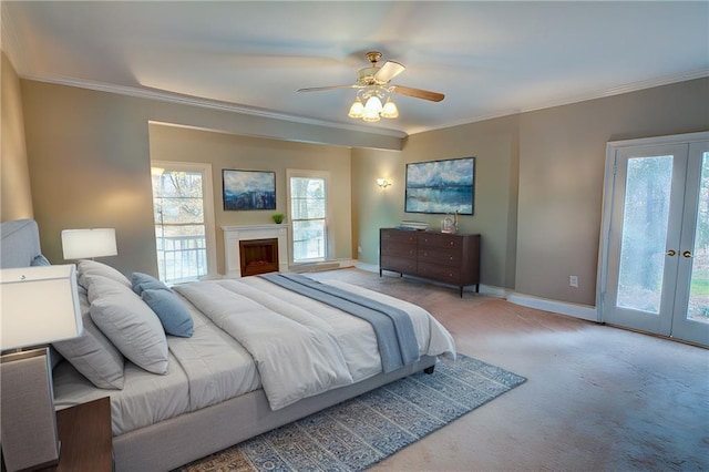 carpeted bedroom featuring french doors, ceiling fan, crown molding, and access to outside