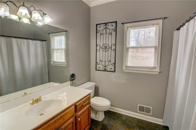 bathroom featuring vanity, crown molding, and toilet