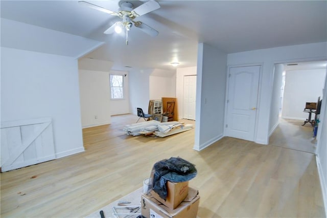 additional living space with ceiling fan and light hardwood / wood-style floors