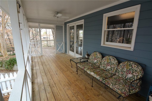 deck with covered porch and ceiling fan