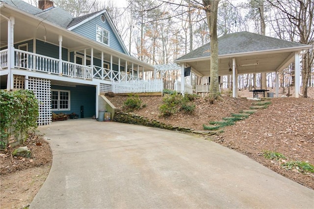 view of side of property with a porch