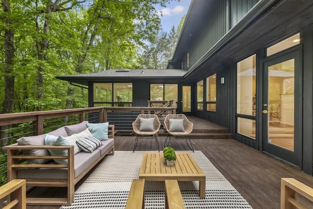 deck featuring an outdoor living space and outdoor dining area