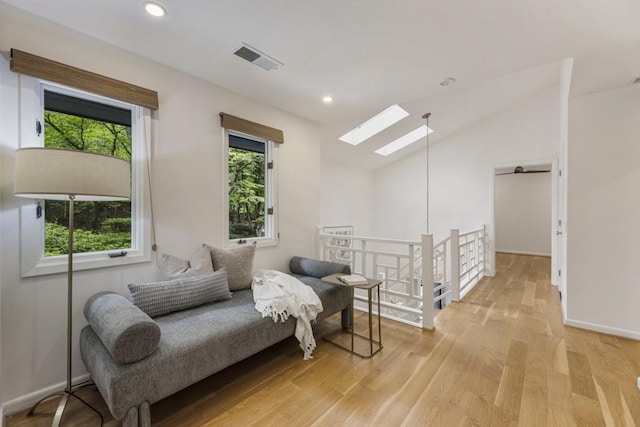 sitting room with light wood-style flooring, recessed lighting, baseboards, an upstairs landing, and visible vents