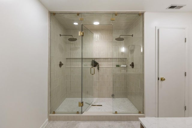 full bathroom featuring visible vents, baseboards, and a stall shower