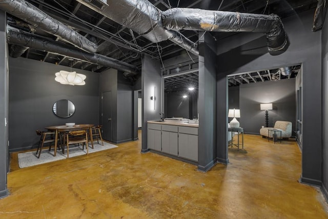 below grade area with visible vents and a sink