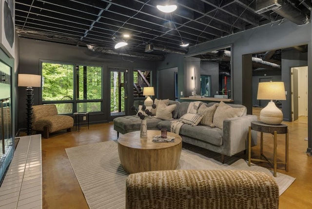 living room featuring concrete flooring