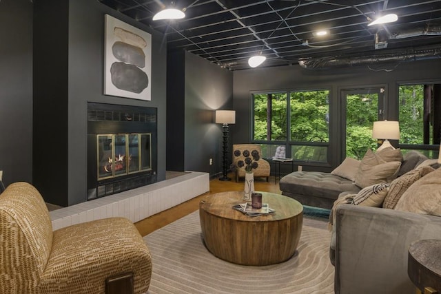 living area with wood finished floors and a fireplace