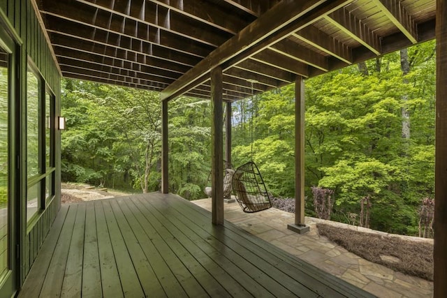 wooden deck featuring a view of trees