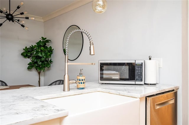 interior space with a sink and ornamental molding