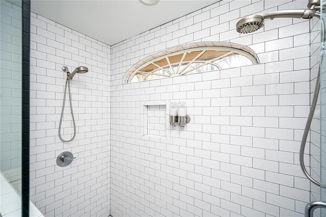 full bath featuring a shower stall