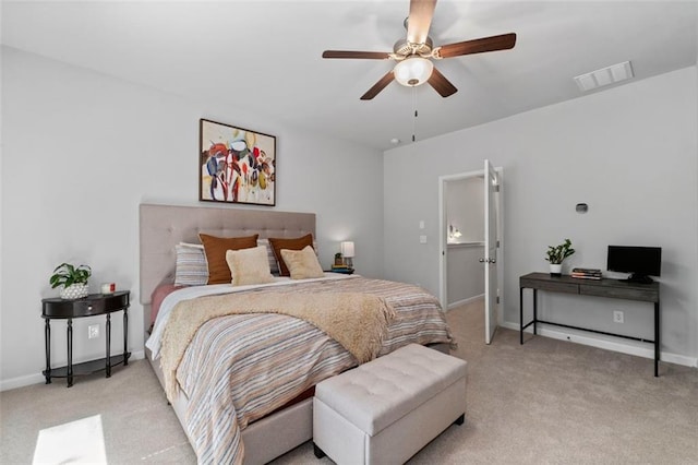 carpeted bedroom with baseboards and ceiling fan