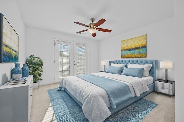 bedroom with light colored carpet, a ceiling fan, french doors, and access to exterior