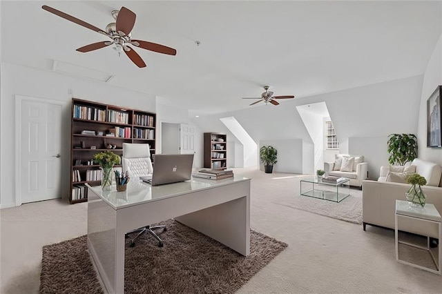 office featuring light carpet, a ceiling fan, and lofted ceiling