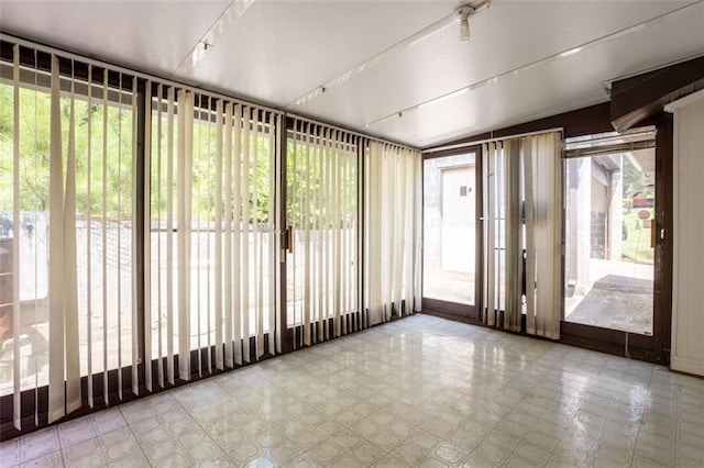 unfurnished sunroom with a healthy amount of sunlight