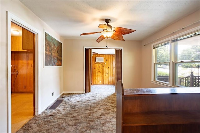 unfurnished bedroom featuring carpet floors and ceiling fan