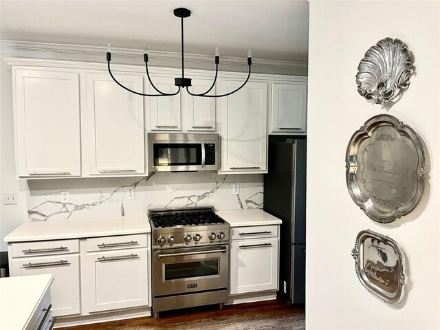 8525 Anchor On Lanier Ct, Gainesville, GA 30506 - kitchen featuring appliances with stainless steel finishes, light countertops, white cabinets, tasteful backsplash, and dark wood-style floors