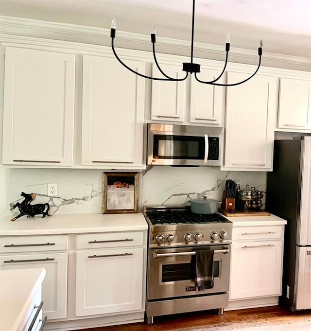 8525 Anchor On Lanier Ct, Gainesville, GA 30506 - kitchen featuring appliances with stainless steel finishes, light countertops, white cabinets, backsplash, and light wood-type flooring