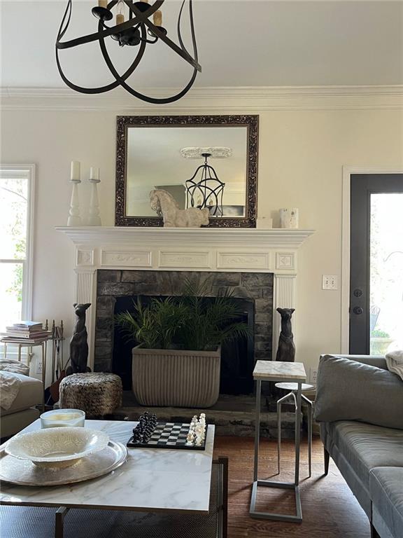 8525 Anchor On Lanier Ct, Gainesville, GA 30506 - living area with a fireplace, crown molding, and dark wood-style floors