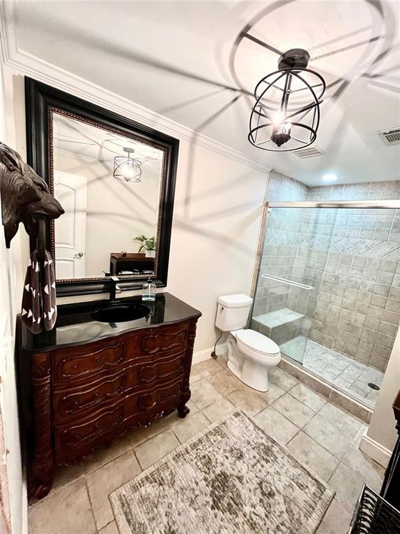 8525 Anchor On Lanier Ct, Gainesville, GA 30506 - bathroom featuring vanity, toilet, a shower stall, tile patterned floors, and baseboards