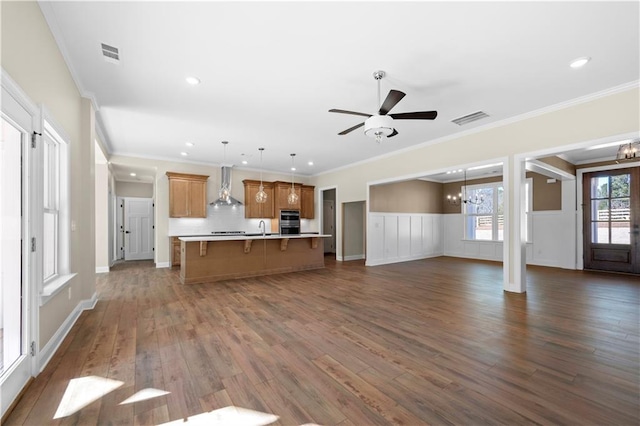 4762 Conns Creek Rd, Ball Ground, GA 30107 - unfurnished living room with a chandelier, dark wood-type flooring, ceiling fan, recessed lighting, and crown molding