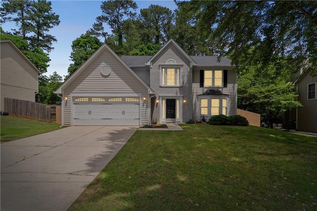 traditional home with concrete driveway and an attached garage