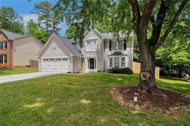 traditional home featuring a garage and driveway