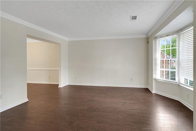 unfurnished room with dark wood finished floors, ornamental molding, baseboards, and a textured ceiling