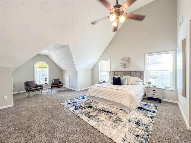 carpeted bedroom with ceiling fan and lofted ceiling