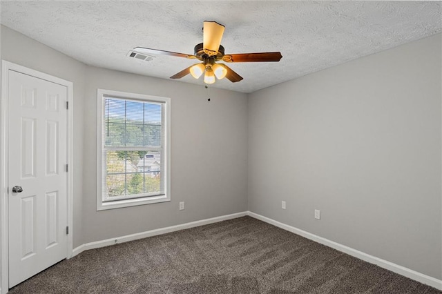 carpeted empty room with a textured ceiling and ceiling fan