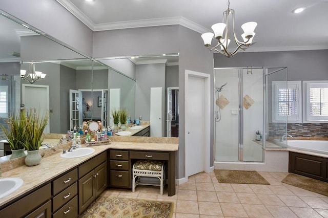 bathroom with a chandelier, a stall shower, double vanity, a bath, and ornamental molding