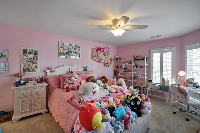 carpeted bedroom featuring a ceiling fan