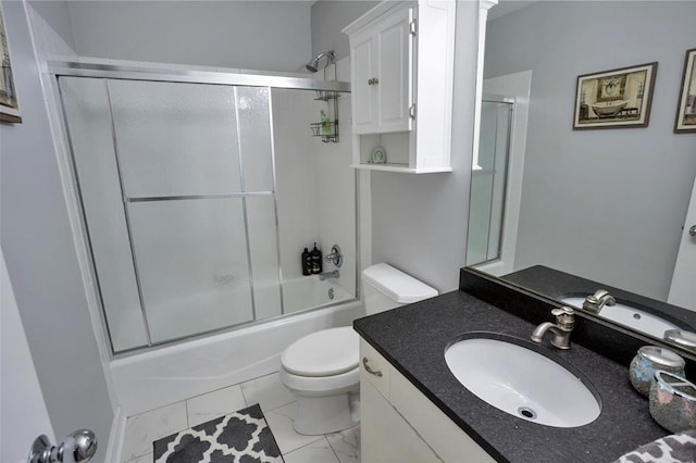 bathroom with toilet, combined bath / shower with glass door, marble finish flooring, and vanity