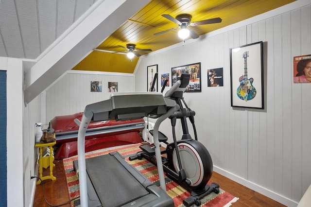 workout area featuring ceiling fan, wood finished floors, baseboards, and wooden ceiling
