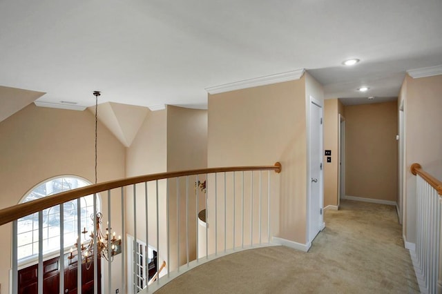 corridor featuring carpet, ornamental molding, baseboards, recessed lighting, and an upstairs landing