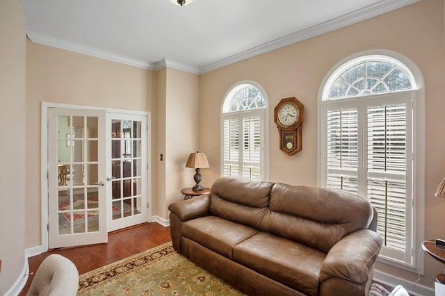 living area with french doors, ornamental molding, wood finished floors, and baseboards