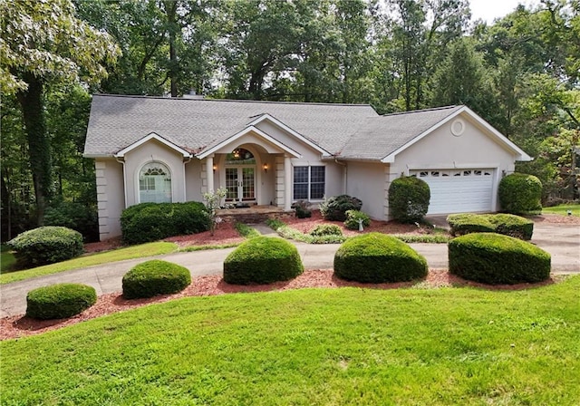 ranch-style house with a front yard and a garage