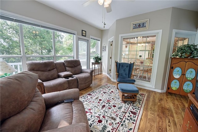 living room with hardwood / wood-style flooring and ceiling fan