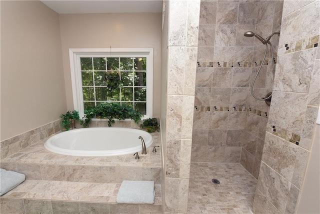 bathroom with shower with separate bathtub