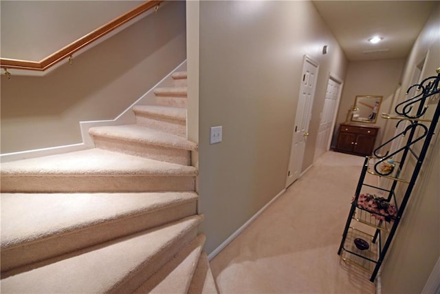 stairway with carpet floors