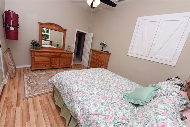 bedroom featuring light hardwood / wood-style floors and ceiling fan