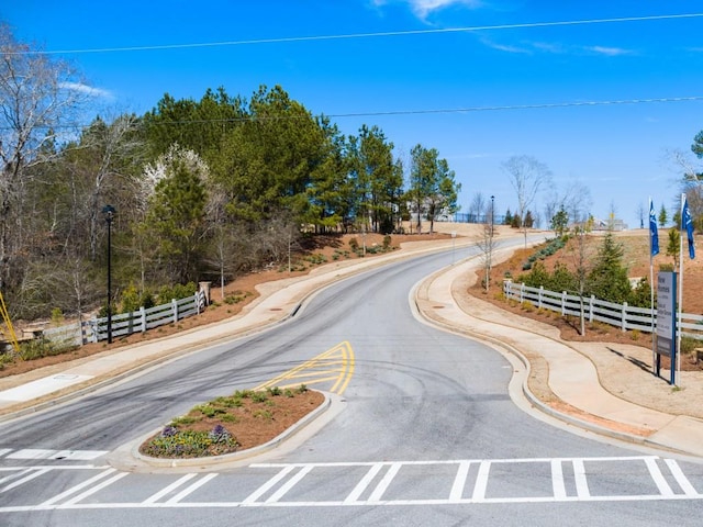 414 Oak View Ln, Dallas, GA 30157 - view of asphalt road featuring sidewalks, curbs, and street lighting