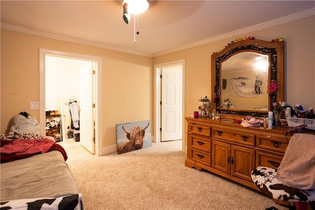 bedroom with light carpet, ornamental molding, and a ceiling fan