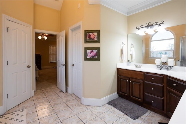 bathroom featuring tile patterned flooring, vanity, and ornamental molding